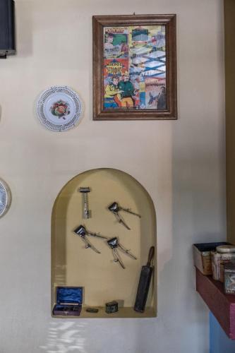 a wall with a clock on a wall at Petroto in Fragkades