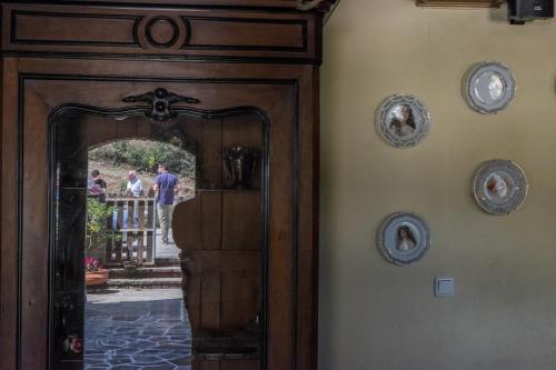 a wooden door in a room with people on a fence at Petroto in Fragkades