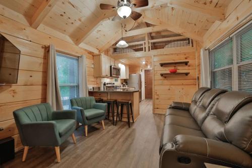a living room with a couch and chairs and a kitchen at Martha Cabin Tiny Cabin By Downtown Chattanooga in Chattanooga