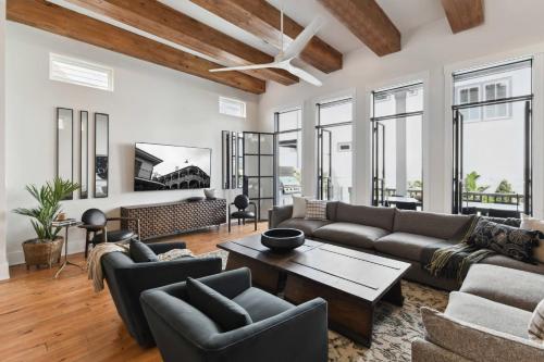 a living room with a couch and a table at New Luxury Home Heated Pool & Spa in New Orleans