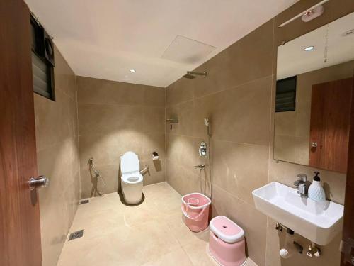 a bathroom with a toilet and a sink at 7 Tree Resort & Restaurant in Pune