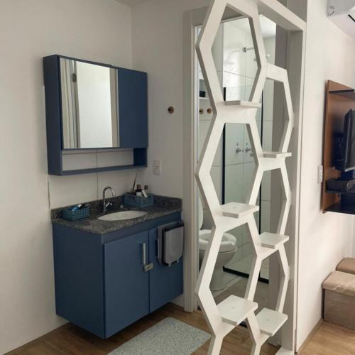a bathroom with a sink and a mirror at Loft Moderno Vista Mar - 14 Minutos De Copacabana in Rio de Janeiro