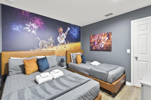 a bedroom with two beds and a painting on the wall at Near Disney Private Hot Tub April Deal in Kissimmee