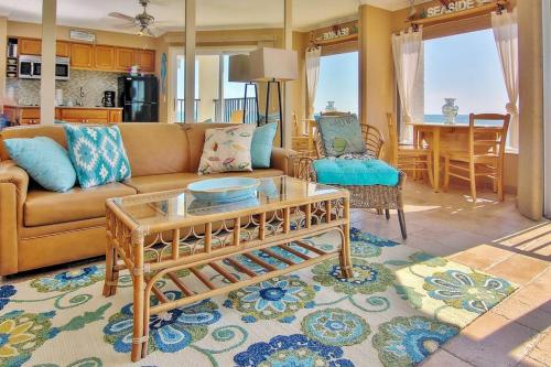 a living room with a couch and a table at Belleair Beach Club 315 in Clearwater Beach