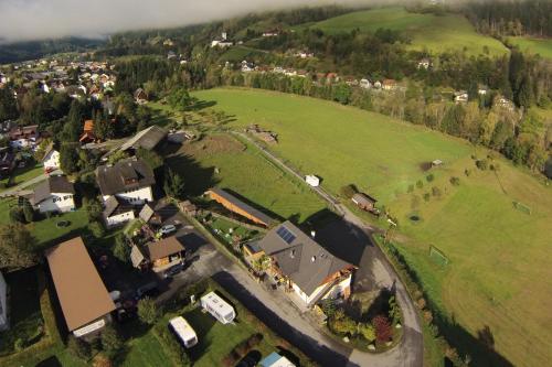an aerial view of a village with houses and a field at Da Bräuhauser in Stadl an der Mur