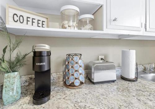 a kitchen counter with a coffee maker and a toaster at Hillside Haven - affordable and convenient in Chattanooga