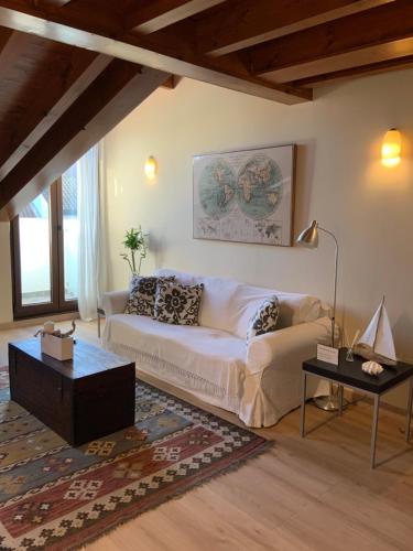 a living room with a couch and a table at La plaza de llanes, Plaza Parres Sobrino, 6 in Llanes
