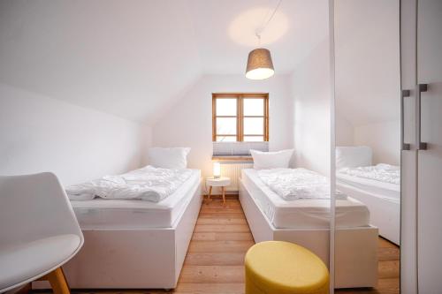 a room with three beds and a window at Freya in Goltoft