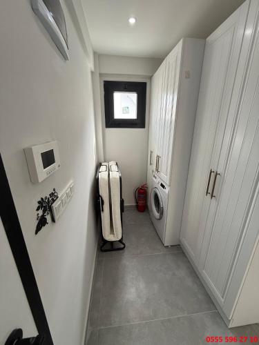 a laundry room with a washer and dryer at Erdem Apart D4 in Dalaman