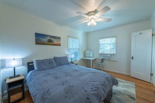 a bedroom with a bed and a ceiling fan at Park Street Pad in Paso Robles