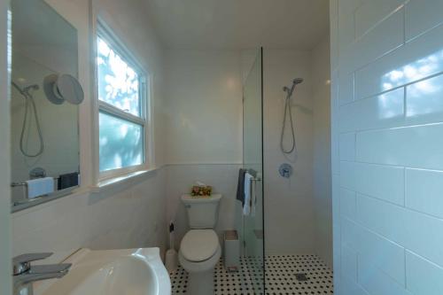 a bathroom with a toilet and a sink and a shower at Park Street Pad in Paso Robles