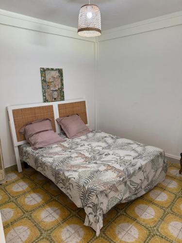 a bedroom with a bed in a room at Chez Charline in Saint-Claude