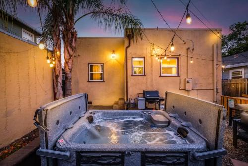 a jacuzzi tub in the backyard of a house at Unique Bungalow w/ hot Spa in DT in Sacramento