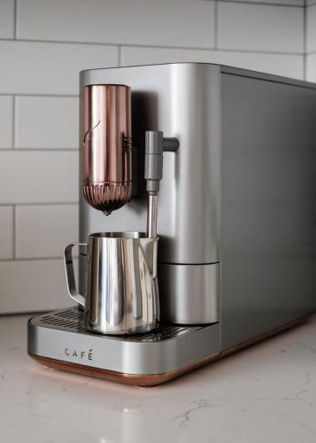 a coffee maker sitting on top of a counter at The Slate Luxury Capitol View DOCO Golden 1 in Sacramento