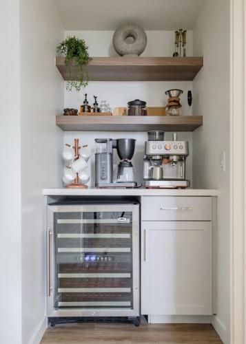 a small kitchen with a stove and a shelf at The Eyrie Group Fun Luxury DT Events Corporate in Sacramento