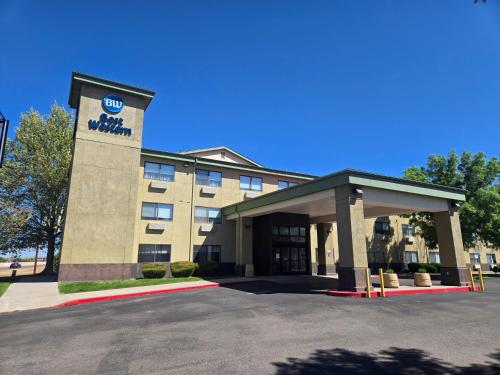 a hotel with a parking lot in front of it at Best Western North I-25 Hotel in Albuquerque