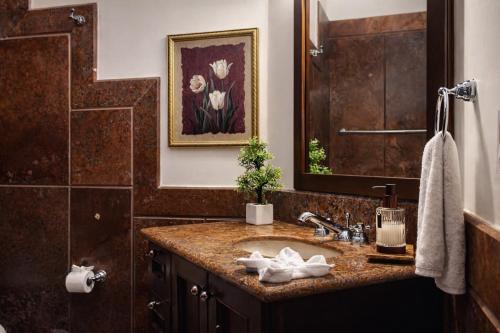 a bathroom with a sink and a mirror at Solanza Hotel Hacienda in Cancún