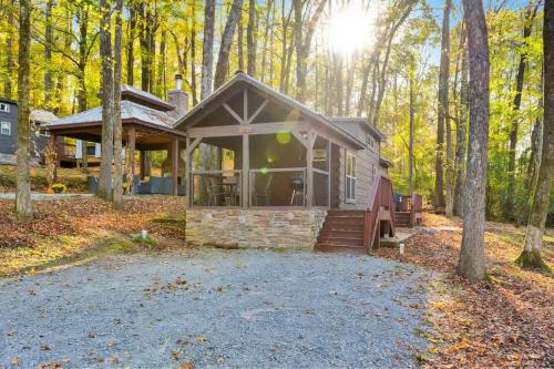 a small house in the woods with trees at Eliza Cabin Nature Nested Tiny Cabin W Hot Tub in Chattanooga