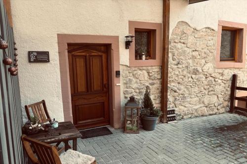 an entrance to a building with a wooden door at Ferienparadies in der Vulkaneifel in Roth