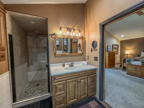 a bathroom with a sink and a shower at New: Lake Access with Dock Slip More in Swanton