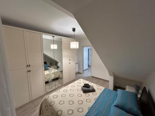 a bedroom with a bed and a mirror at Boffi house in Sezze