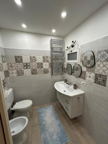 a bathroom with a toilet and a sink at Boffi house in Sezze