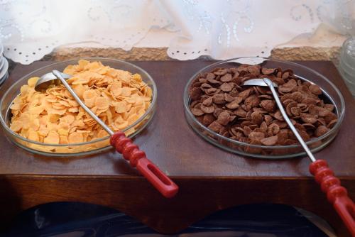 two bowls of different types of food on a table at Hotel Porto Perissa in Perissa
