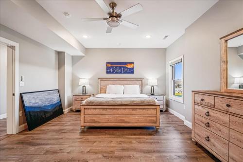 a bedroom with a bed and a ceiling fan at THE VIEW Hot Tub Fire Pit Private in McHenry