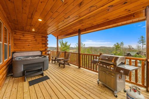 a screened in porch with a grill and a barbecue on it at Indoor Pool Hot Tub, Pets Welcome, Arcade Games - Sleeps 14 in Pigeon Forge