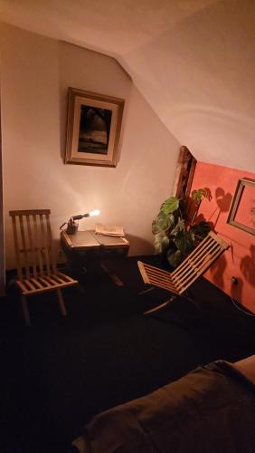 a room with a desk and chairs in a room at Southfork Farma Všetice in Benešov