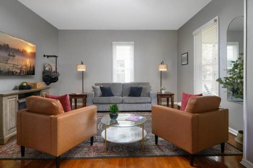 a living room with two chairs and a couch at Elegant House 2 min from BSU/Hospital/Downtown in Muncie