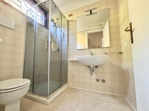 a bathroom with a toilet and a sink at D'Annunzio in Gardone Riviera