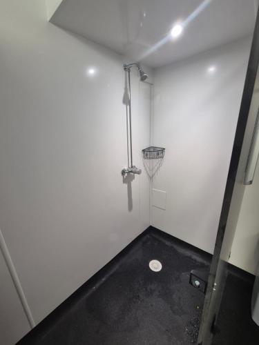 a white room with a basketball hoop on the wall at Woodlands Centre in Betws-y-coed