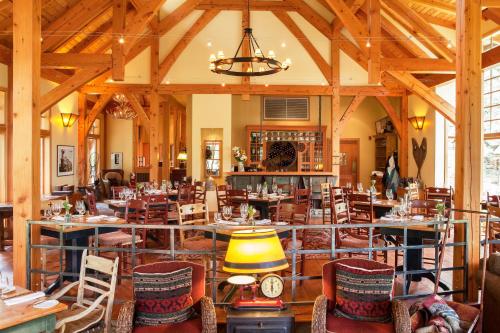 a large dining room with tables and chairs at Cathedral Mountain Lodge in Field