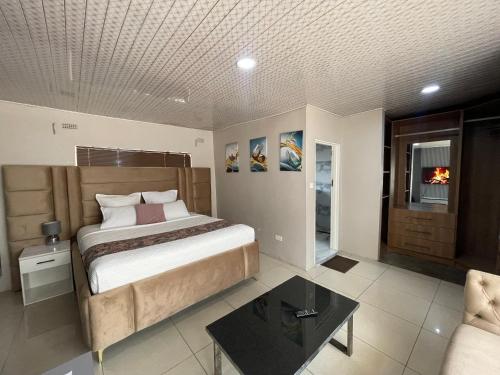 a bedroom with a bed and a table in it at Alamaison in Umtali