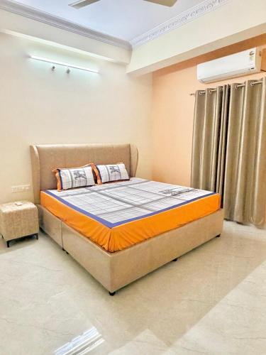 a bedroom with a bed in a room at Elite Apartment in Hyderabad