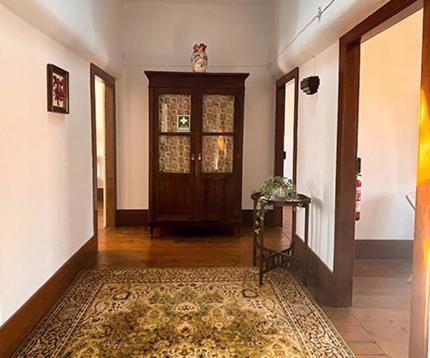 a hallway with a door and a rug in a room at Esposende Garden in Esposende