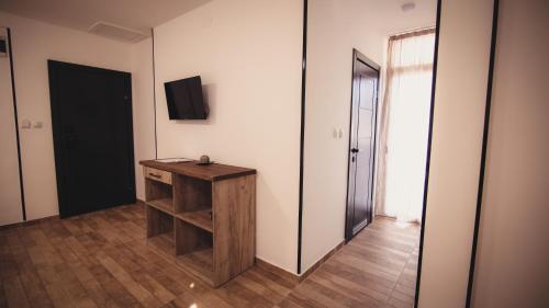 a room with a wooden table and a mirror at Saint Sava in Ohrid