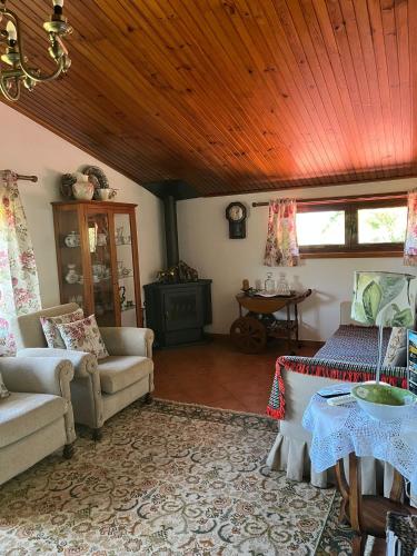 a living room with a couch and a table at Quinta de Carcavelos Agroturismo e Enoturismo in Celorico de Basto