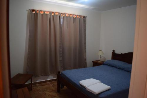 En eller flere senge i et værelse på Complejo Ruca Anay (Casa de amigos)