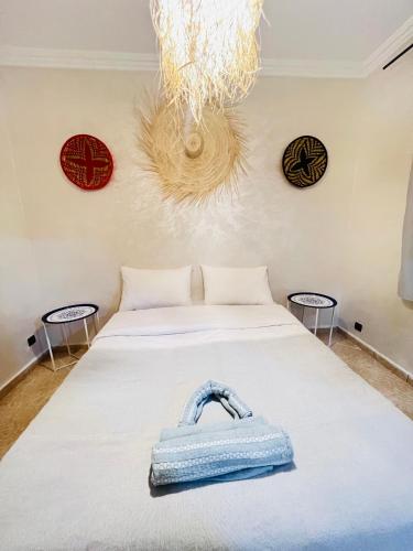 a blue purse sitting on a bed in a room at sun house tamraght in Tamraght Ouzdar