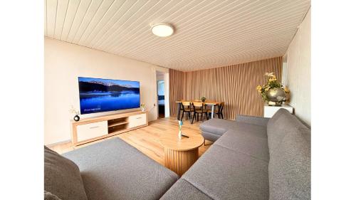 a living room with a couch and a flat screen tv at 4 Bedrooms Villa Next to Fermen & Puttgarden & Lalandia in Rødby