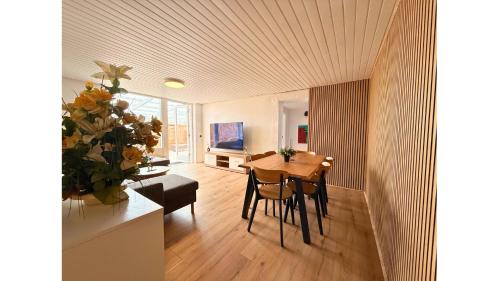 a kitchen and dining room with a table and chairs at 4 Bedrooms Villa Next to Fermen & Puttgarden & Lalandia in Rødby