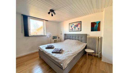 a bedroom with a bed and a window at 4 Bedrooms Villa Next to Fermen & Puttgarden & Lalandia in Rødby