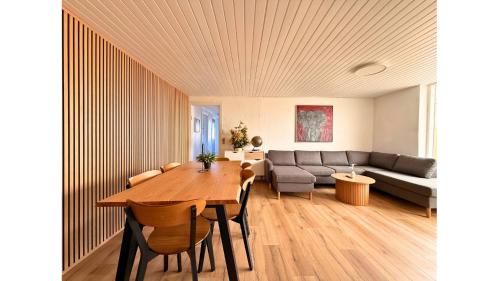 a living room with a table and a couch at 4 Bedrooms Villa Next to Fermen & Puttgarden & Lalandia in Rødby