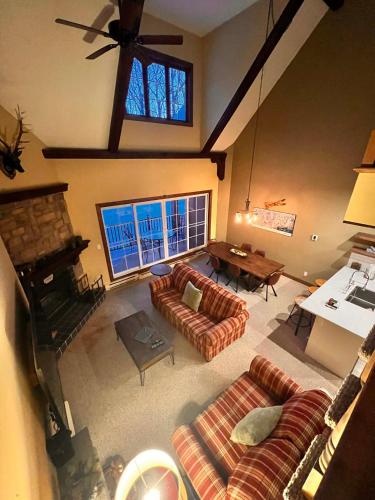 a large living room with couches and a fireplace at Manoir Signature in Mont-Tremblant