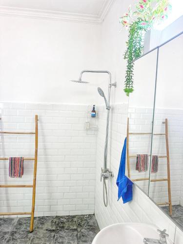 a bathroom with a shower and a sink at Bliss Villa Central Kuta in Kuta Lombok