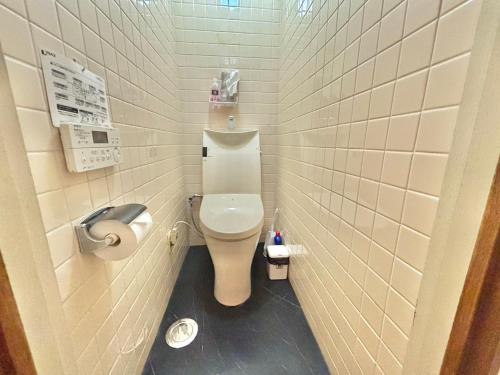a small bathroom with a toilet in a stall at HoTTOSTAY矢田 in Nagoya