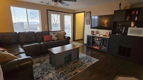 a living room with a couch and a coffee table at Lighthouse Basement Guest Suite in Provo