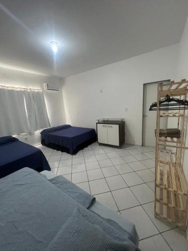 a room with two beds and a ladder in it at Allmedhouse in São Luís